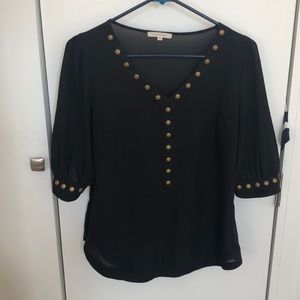 Black top with brass button detail